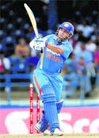 Indias opener Parthiv Patel hits a six off West Indies Andre Russell during their T20 match at Port of Spain, Trinidad on Saturday.