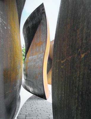 The torus-shaped elements of Dirks Pod by Richard Serra stand on the campus, raising their heads skywards, lifting the spirit of anyone who sees them