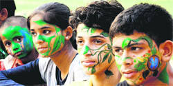 Students of Theatre Age sport painted faces on the occasion of the World Environment Day in Chandigarh on Sunday