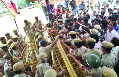 Policemen stop supporters of Baba Ramdev from entering the Ramlila Maidan in New Delhi on Sunday 