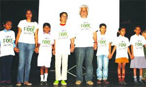 Bollywood veteran actor Om Puri with the children make a human chain to challenge the governments move to destroy forests and extract coal for energy, at a function in New Delhi on Sunday.