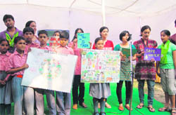 School students at a function to celebrate World Environment Day, organised by Citizens for Green Doon, at Gandhi Park, Dehradun, on Sunday. 