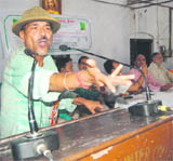 Ram Babu, alias Junglee, an avid animal lover, addresses a function to mark World Environment Day in Dehradun on Sunday.