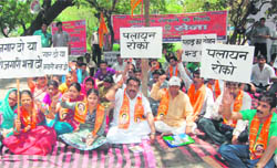 Workers of the Shiv Sena hold a dharna in support of their demands at Gandhi Park, Dehradun, on Sunday