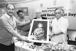 Jairam Ramesh being presented a painting on World Environment Day in New Delhi on Sunday