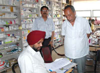 Drug Inspector Lakhwant Singh during the checking.