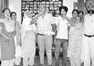 Staff members of Government Senior Secondary School, Kharar, congratulate Balwinder and Kirandeep