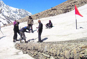 Jawans of the ITBP put up flags on the trek route to Kailash Mansarovar in Pithoragarh district. 