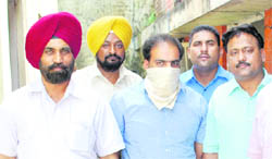 The junior engineer of the PSPCL who was caught red-handed by the vigilance bureau while taking bribe in Ludhiana on Monday.