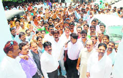 One-upmanship Congress councillor from ward No. 39 Sanjay Talwar along with others inaugurates the project for the carpeting of road from Khud Mohalla to Pothohar School, near old Civil Hospital, in Ludhiana on Monday.