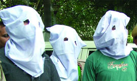 The accused in police custody. 