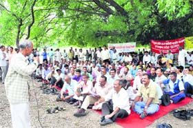 Class IV employees of the state government hold a dharna at Gandhi Park, Dehradun, on Tuesday