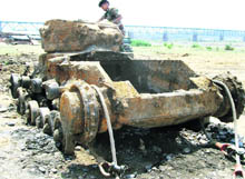 A soldier atop a vintage tank which was recovered from the Ravi in Kathua on Tuesday