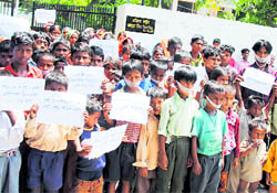 Children of victims of fire at Hussainpura village protest against MLA Darshan Singh Shivalik in Ludhiana on Tuesday