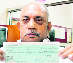 Rakesh Talwar, who was fighting a case against the municipal corporation for the past 12 years ever since he slipped into an open manhole on a flooded street in the Dhobi Ghat area on the Rajpura Road, was awarded cheque for Rs 8.5 lakh 