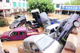 Cars float, boat grounded: Vehicles swept away by flood in Wangmo County in Chinas Guizhou province in China