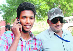 Virender Singh, who secured 90 per cent in arts, with his father, who is visually impaired.
