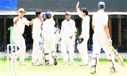 Amritsar players celebrate after dismissing a Mohali batsman during their match at the PCA stadium in Mohali on Thursday. 
