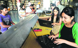 Students use wi-fi at the AC Joshi Library in Panjab University, Chandigarh. 