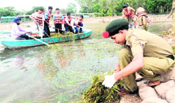 cadets clean the Sukhna Lake in Chandigarh on Thursday. 