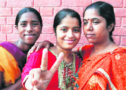 Priya Rani, who secured 92.8 per cent in medical stream in Class XII examination, with family