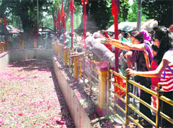 Devotees offer water, milk and flowers at the spring at the Khir Bhawani temple in Tulmulla village