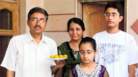 PMET topper Rajat with his parents and sister.