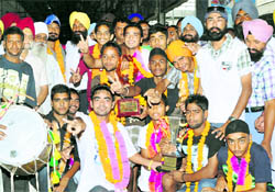 Under-17 Punjab hockey team pose for a picture after winning gold in national hockey event