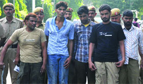 Members of a gang of carjackers that was busted by the Delhi police on Friday . Tribune photo Members of a gang of carjackers that was busted by the Delhi police on Friday .