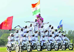 Army motor cyclists display their skills before President Pratibha Patil at Indian Military Academy, Dehradun, on Friday