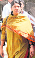 DMK MP Kanimozhi arrives at Patiala House court in New Delhi on Friday. 