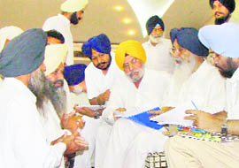 Punjab CM Parkash Singh Badal at a Sangat Darshan at Bhadson village in Patiala on Friday. He disbursed grants worth Rs 6.21 crore among 54 village panchayats for the execution of various development and welfare projects. 