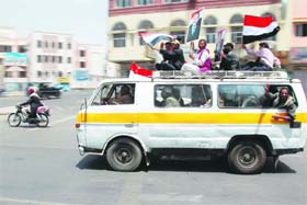 Supporters of Yemens President Ali Abdullah Saleh ride a van on way to attend a rally in Sanaa on Friday. Loyalists celebrated after reports of his return to Yemen