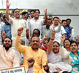 BJP Delhi unit president Vijendra Gupta along with party workers holds a protest against corruption on Saturday.