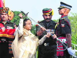 President Pratibha Patil presents the Sword of Honour to Gentleman Cadet Rohit Shekhar at the passing-out parade of the IMA, Dehradun