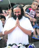 Sri Sri Ravi Shankar coming out after meeting Ramdev at a hospital near Rishikesh. 