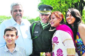 Antriksh Salathia, a gentleman cadet from Samba district, with his family members after passing out of the Indian Military Academy in Dehradun on Saturday