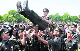 Gentlemen Cadets celebrate after the passing out parade of the Indian Military Academy, Dehradun, on Saturday