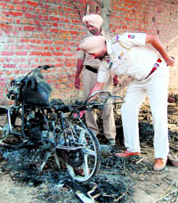 Cops inspect the explosion site at Ibban Kalan village in Amritsar