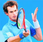 Andy Murray hits a return against Andy Roddick during the semifinals of AEGON Championships at Queen's Club in London on Saturday