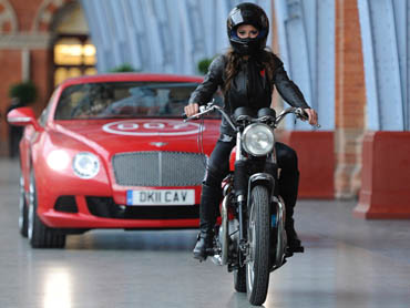 Model Chesca Miles rode a BSA Spitfire motorbike to launch the new James Bond book Carte Blanche at  St Pancras station in London