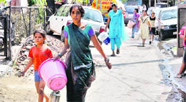  Residents in search of water at Attawa village in Chandigarth on Sunday.