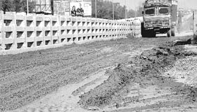Aftermath A view of the muddy service road, along the railway flyover, on the Dera Bassi highway after the rain on Sunday.