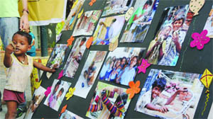 A street child at a photo exhibition organised by the CRY Foundation on Anti-Child Labour Day at Delhi Haat in New Delhi 