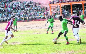 A match of the national football tournament being played at DS Bisht Stadium at Pithoragarh on Sunday