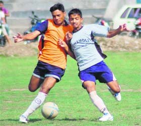 A match in Lala Nemi Dass Memorial Football District League under way in Dehradun on Sunday