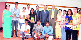 The meritorious students with CIC Bhim Sen at an annual function in Shimla on Sunday.
