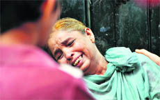 Grief-stricken Shakuntla, mother of Ashok Kumar.