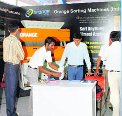 An exhibitor demonstrates the working of a machine at Sahnewal. 