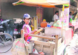 customers welcome Ranjit Kumar sells goods at a cart. 